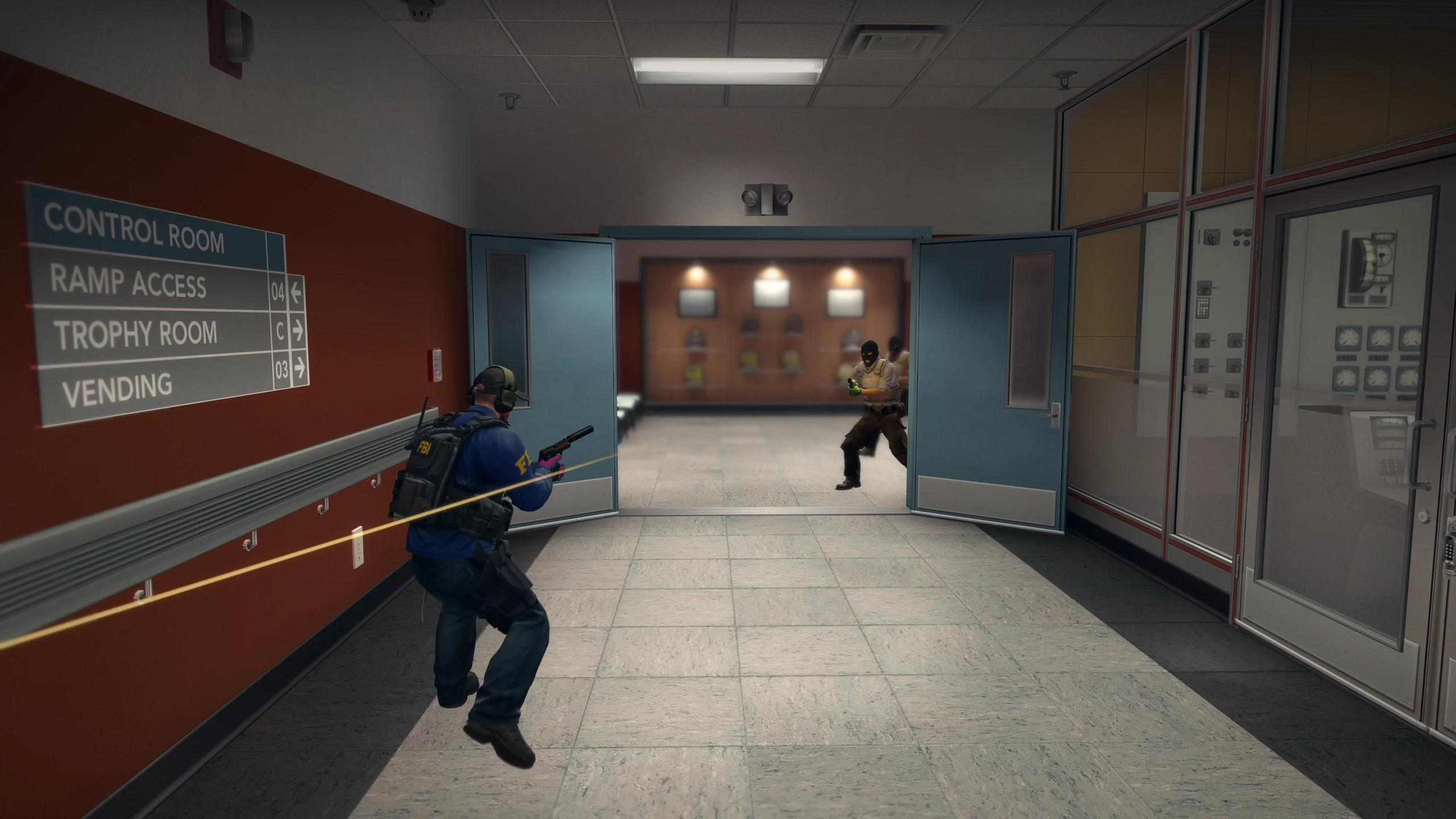 A defender jumps through a corridor on Nuke as an attacker comes through the doors